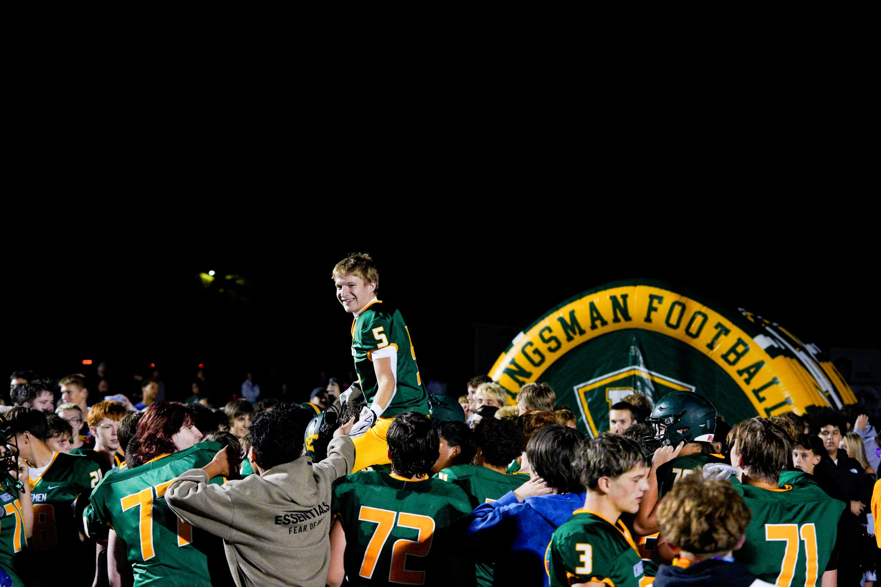Players and supporters gathered under Friday night lights